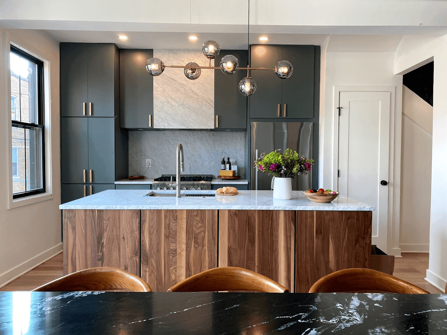 Modern two-tone kitchen with light upper cabinets and contrasting lower cabinets