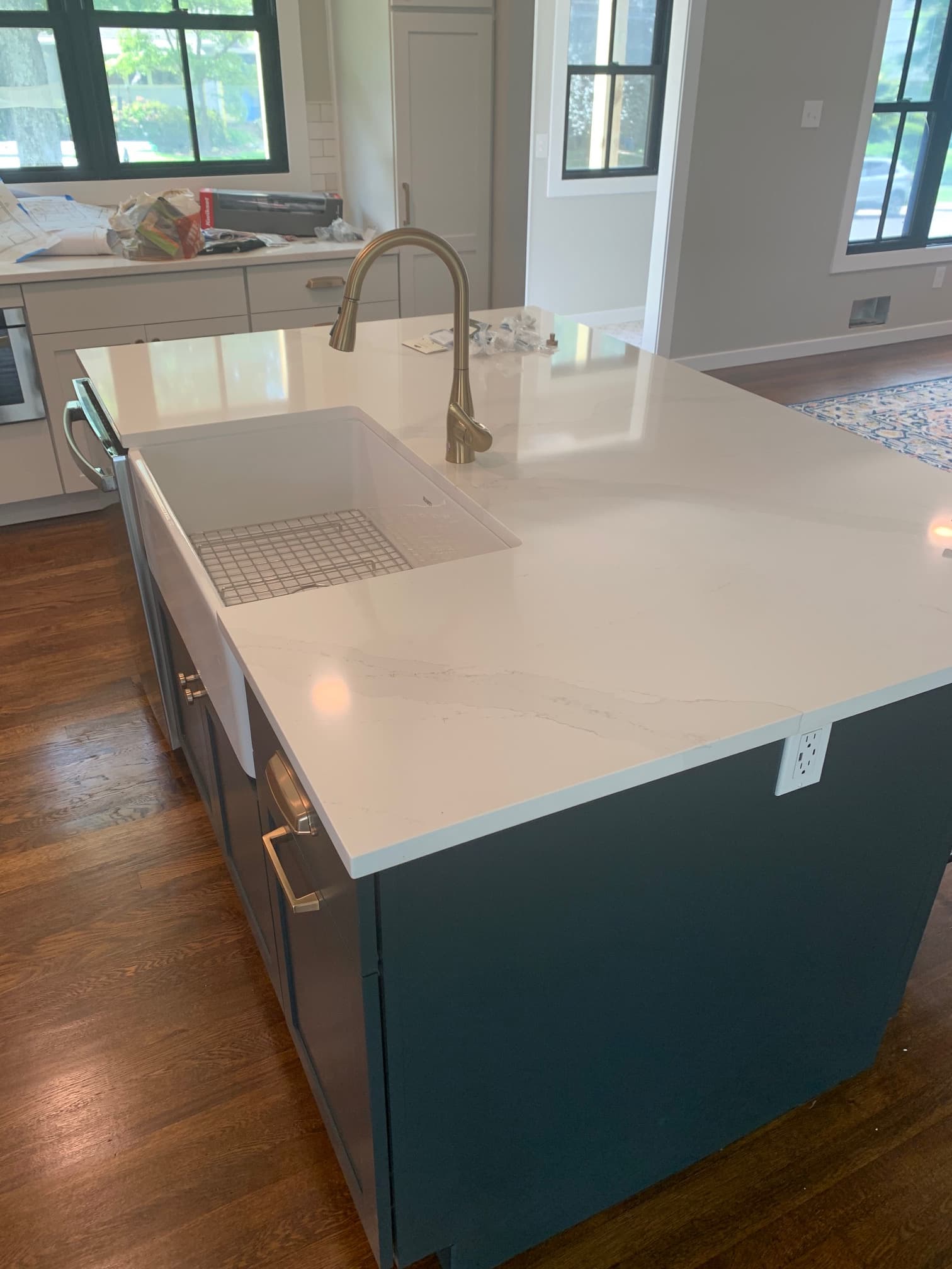 Navy blue shaker kitchen with light countertops